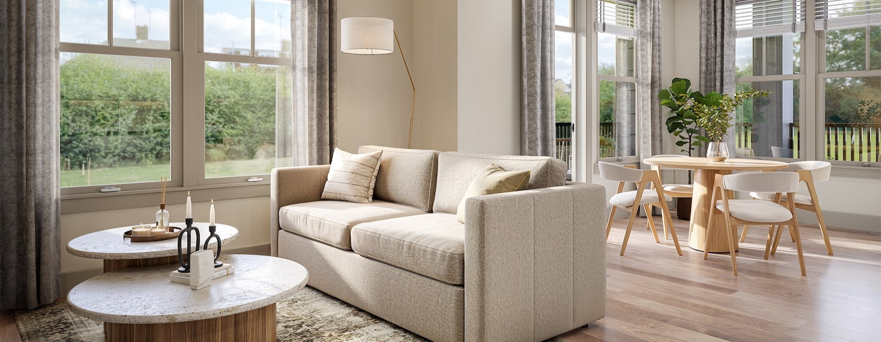 a living room with a couch, coffee table and lamp