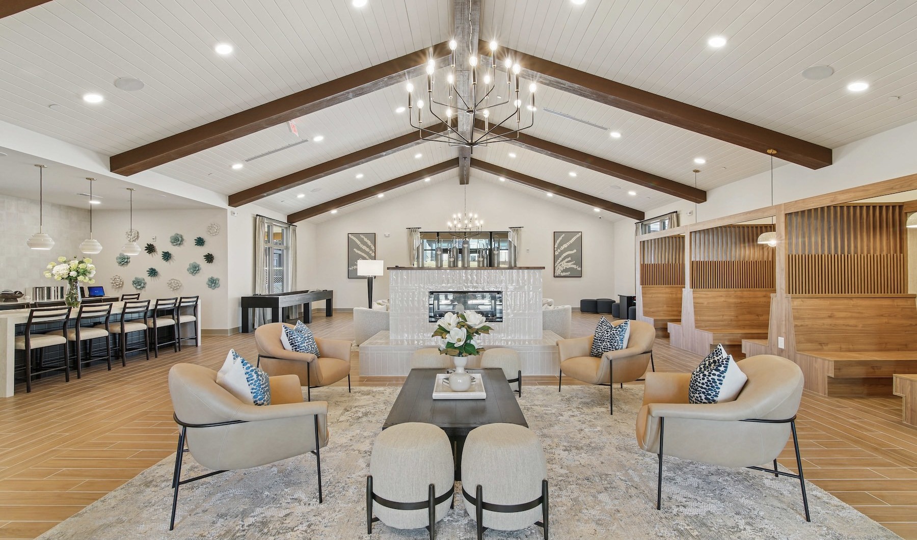 a spacious clubroom with ample seating and lighting